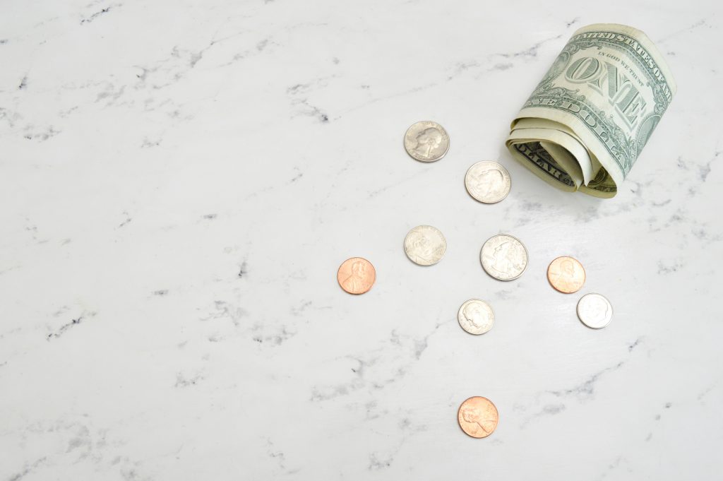 cash and coins on a countertop
